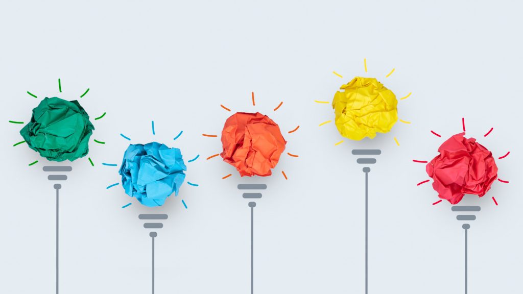 Brightly coloured balls of paper representing lightbulb ideas